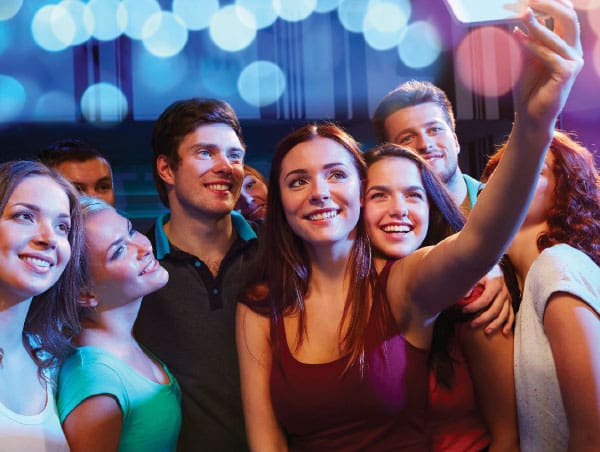Teens taking a selfie